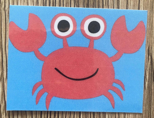 crabe rouge souriant illustration sur fond bleu pour support pédagogique l'océan des sons